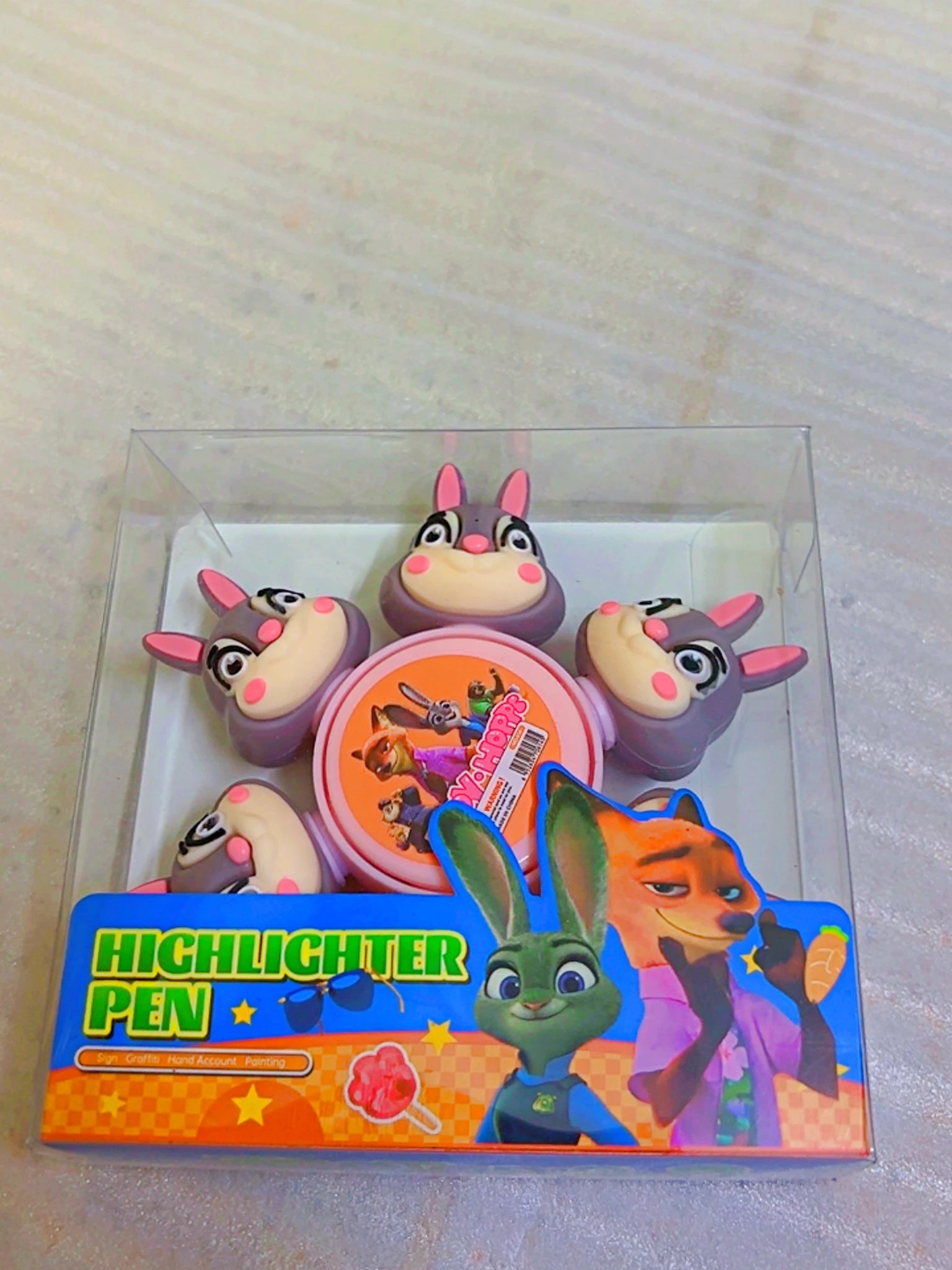 A boxed set of cartoon highlighter pens featuring characters from Zootopia, including Nick Wilde, Judy Hopps, and other animals, in a clear plastic case with a colorful printed insert.