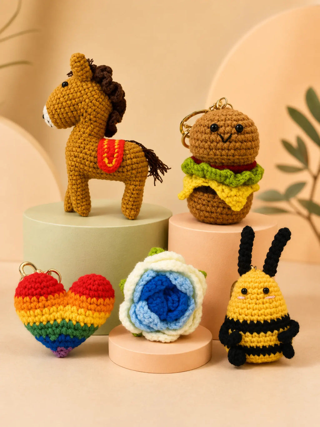Five crochet bag charm designs in premium studio lighting