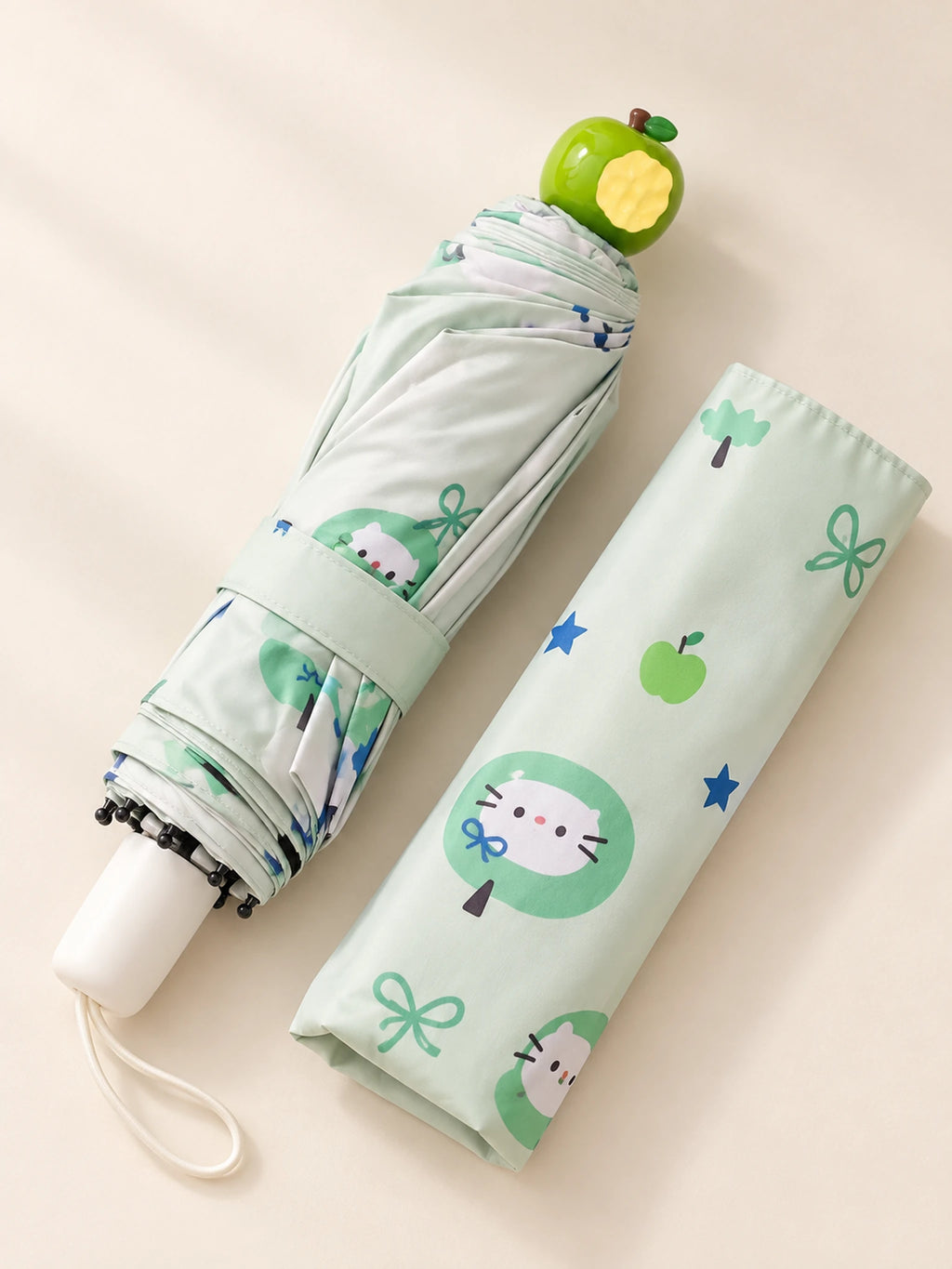Green Apple Umbrella folded with apple-shaped tip and matching sleeve