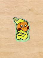 Hand Towel Design G photographed from directly above on a natural wooden tabletop