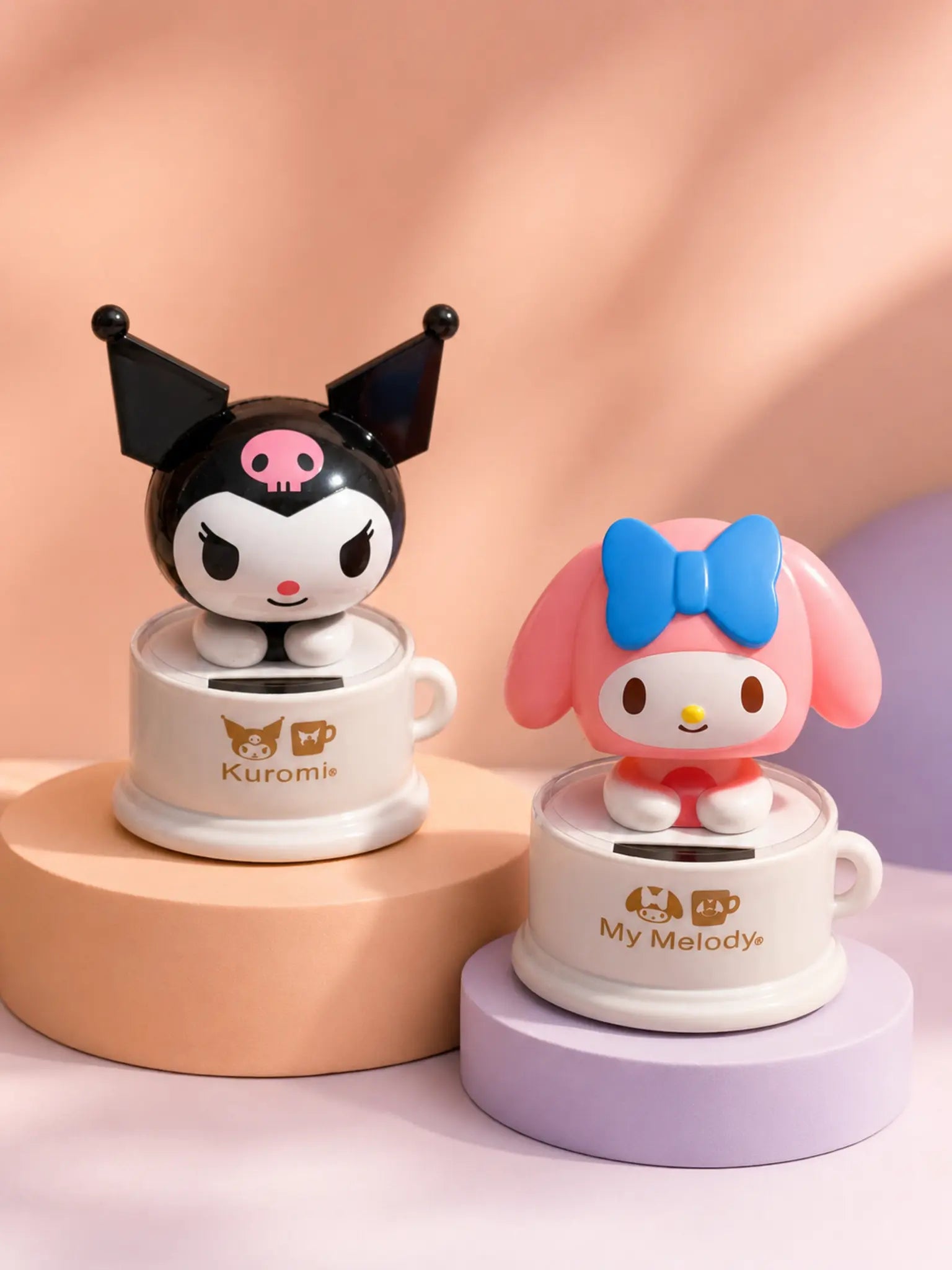 Kuromi and My Melody solar bobbleheads in premium studio lighting