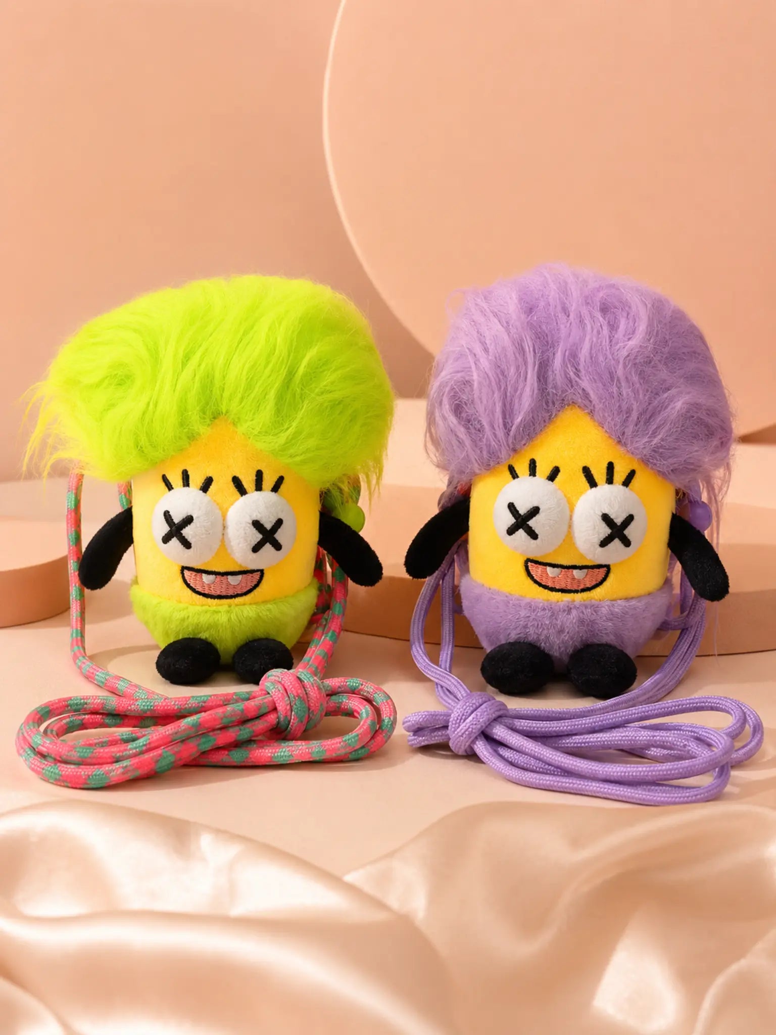 Plush phone slings in neon green and purple