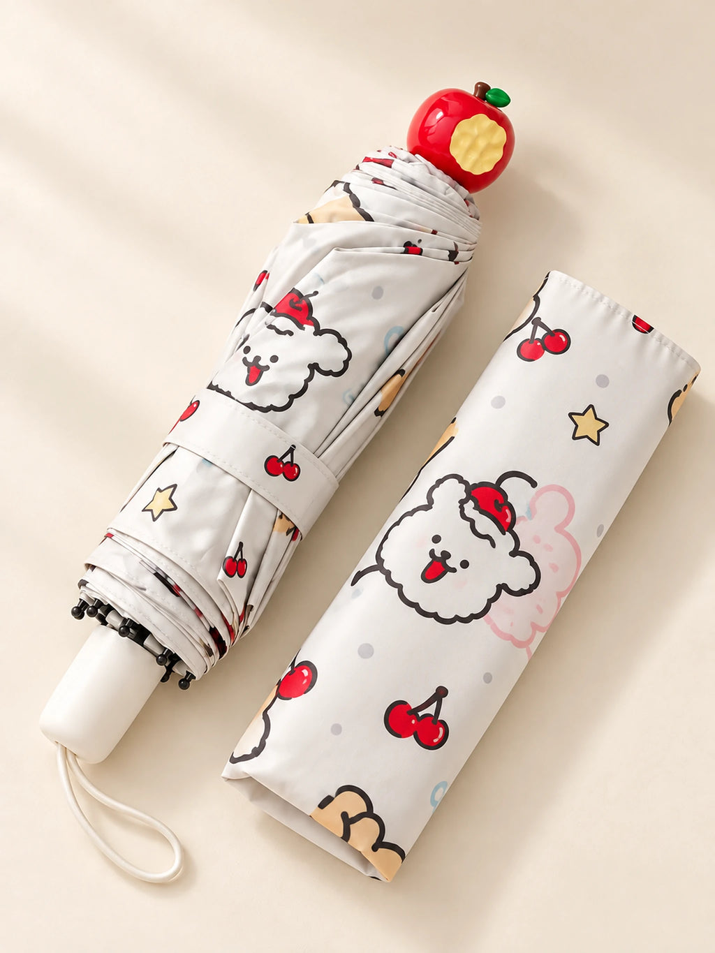 Red Apple Umbrella folded with red apple-shaped tip and matching sleeve